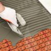 How to install tiles on heating cable decoupling