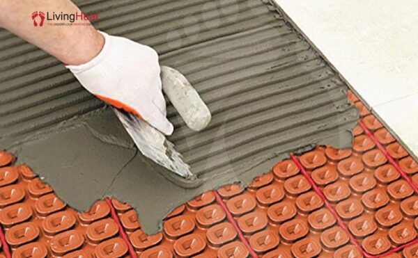 How to install tiles on heating cable decoupling
