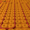 Self-adhesive decoupling mat with lug design for loose wire cables