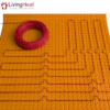 Self-adhesive decoupling mat with lug design for loose wire cables