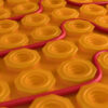 Self-adhesive decoupling mat with lug design for loose wire cables